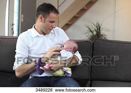 France, man with his baby crying View Large Photo Image Stock Photo - France, man with his baby crying. Fotosearch