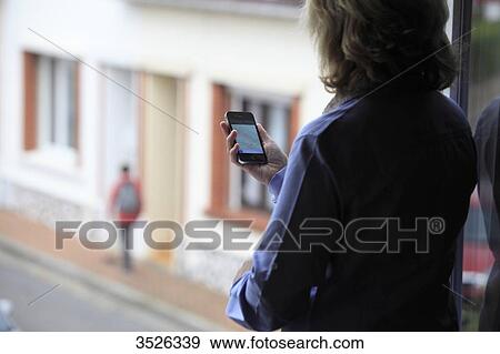 France, mother supervising her son thanks to an application of cellphone localization View Large Photo Image Stock Photo - France, mother supervising her son thanks to an application of cellphone localization. Fotosearch