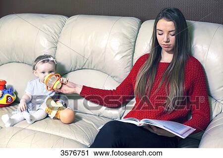 France, nanny or very new mother in the living room View Large Photo Image Stock Image - France, nanny or very new mother in the living room. Fotosearch