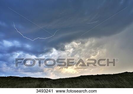 France, Normandy. Annoville. The dunes and the beach. Beginning of a storm. Lightning in the sky View Large Photo Image Stock Image - France, Normandy. Annoville. The dunes and the beach. Beginning of a storm. Lightning in the sky. Fotosearch