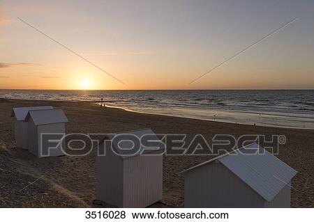 France, Normandy, beach huts on the beach at sunset View Large Photo Image Stock Photo - France, Normandy, beach huts on the beach at sunset. Fotosearch