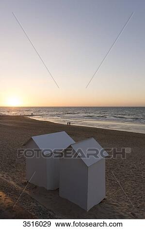 France, Normandy, beach huts on the beach at sunset View Large Photo Image Stock Photo - France, Normandy, beach huts on the beach at sunset. Fotosearch