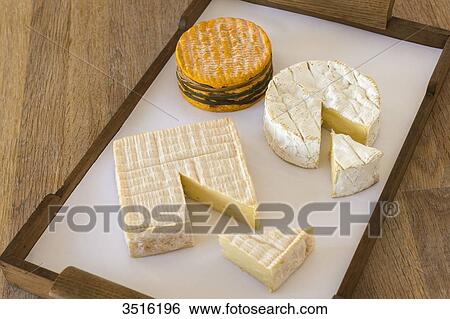 France, Normandy, cheeseboard with three typical norman cheeses View Large Photo Image Stock Photograph - France, Normandy, cheeseboard with three typical norman cheeses. Fotosearch
