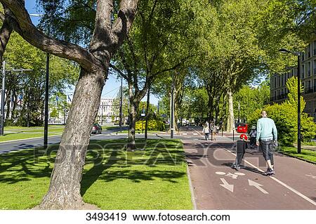 Stock Photo - France, Normandy, Le Havre. Avenue Foch, this magnificent comparable in dimensions to the Champs Elysees avenue in Paris, links Place de l'Hotel de Ville to the Porte Oceane and Le Havre beach.. Fotosearch