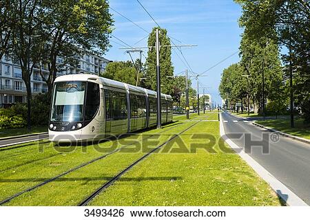 Stock Photograph - France, Normandy, Le Havre. Avenue Foch, this magnificent comparable in dimensions to the Champs Elysees avenue in Paris, links Place de l'Hotel de Ville to the Porte Oceane and Le Havre beach.. Fotosearch