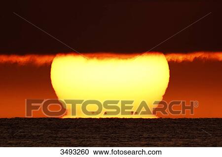 France, Normandy, Montmartin-sur-Mer, Sunset. The black dots at the foot of the sun are the coasts of Jersey View Large Photo Image Stock Image - France, Normandy, Montmartin-sur-Mer, Sunset. The black dots at the foot of the sun are the coasts of Jersey. Fotosearch