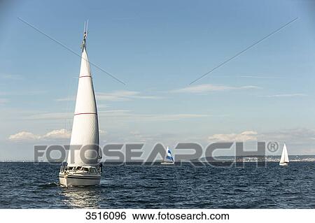 France, Normandy, sailing boats in the sea close to the coast View Large Photo Image Stock Photograph - France, Normandy, sailing boats in the sea close to the coast. Fotosearch