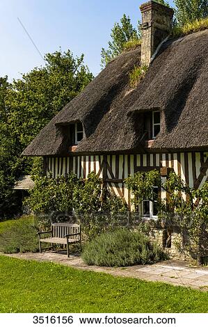 France, Normandy, thatched cottage in traditionnal normandic style with a nice garden View Large Photo Image Stock Photograph - France, Normandy, thatched cottage in traditionnal normandic style with a nice garden. Fotosearch