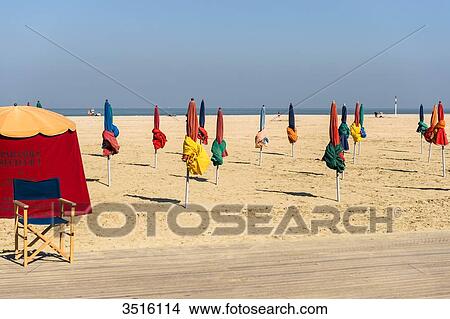 France, Normandy, the beach of Deauville with typical beach umbrellas in many colors View Large Photo Image Picture - France, Normandy, the beach of Deauville with typical beach umbrellas in many colors. Fotosearch