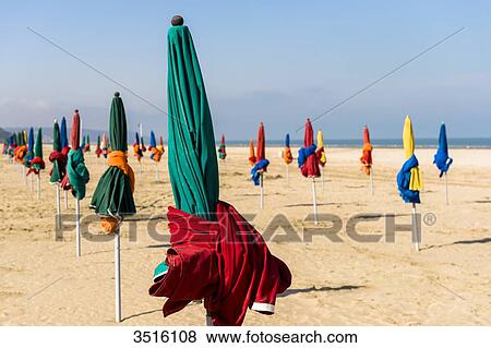 France, Normandy, the beach of Deauville with typical beach umbrellas in many colors View Large Photo Image Stock Photo - France, Normandy, the beach of Deauville with typical beach umbrellas in many colors. Fotosearch