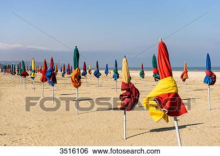 France, Normandy, the beach of Deauville with typical beach umbrellas in many colors View Large Photo Image Stock Photograph - France, Normandy, the beach of Deauville with typical beach umbrellas in many colors. Fotosearch