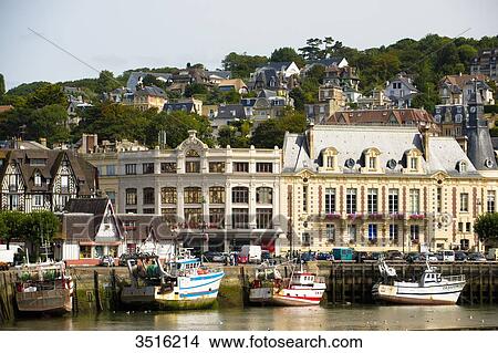 Picture - France, Normandy, the city of Trouville seen from the river. Fotosearch