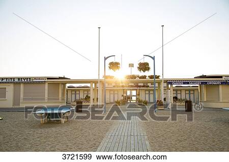 France, Normandy, Trouville, beach front at sunset View Large Photo Image Stock Photo - France, Normandy, Trouville, beach front at sunset. Fotosearch