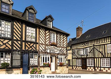 Stock Image - France, Normandy, well preserved old traditionnal houses in normandic style in the village of Beuvron en Auge. Fotosearch