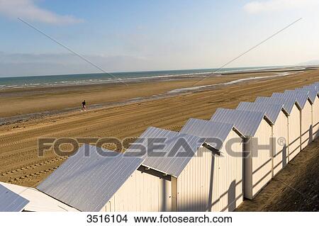France, Normandy, white beach huts in line on the sand View Large Photo Image Picture - France, Normandy, white beach huts in line on the sand. Fotosearch
