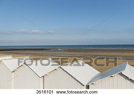 France, Normandy, white beach huts in line on the sand View Large Photo Image Stock Image - France, Normandy, white beach huts in line on the sand. Fotosearch