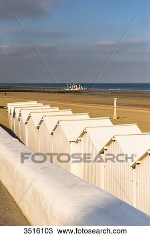 France, Normandy, white beach huts in line on the sand View Large Photo Image Stock Image - France, Normandy, white beach huts in line on the sand. Fotosearch