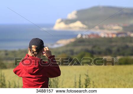 France, North Coast woman taking pictures View Large Photo Image Stock Photo - France, North Coast woman taking pictures. Fotosearch