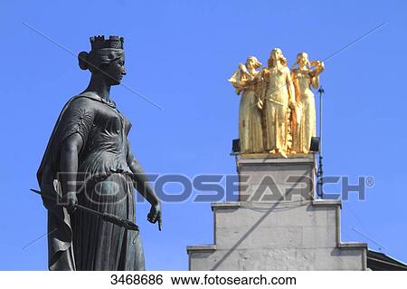 France, North-Eastern France, Lille, Column of the Goddess on the General De Gaulle square. Background: headquarters of the newspaper La Voix du Nord with 3 golden statues at its top View Large Photo Image Stock Photograph - France, North-Eastern France, Lille, Column of the Goddess on the General De Gaulle square. Background: headquarters of the newspaper La Voix du Nord with 3 golden statues at its top. Fotosearch