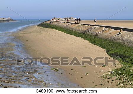 Stock Image - France, Northern France, Gravelines. Petit-Fort Philippe. Embankment at the mouth of the Aa.. Fotosearch