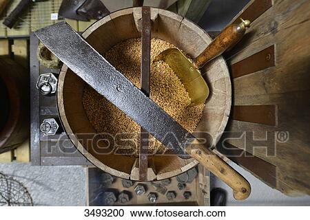 France, old machete lying on a wooden bucket containing grains of wheat. Copper shovel in grains View Large Photo Image Stock Image - France, old machete lying on a wooden bucket containing grains of wheat. Copper shovel in grains. Fotosearch