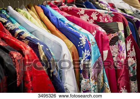 Stock Photograph - France. Paris 13th district. Avenue d'Ivry. Parisian Chinatown. Kimono in a clothing store. Fotosearch