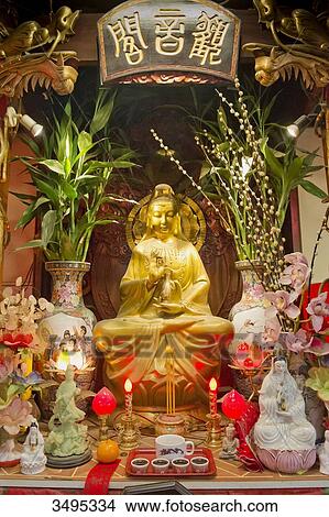 Picture - France. Paris 13th district. Parisian Chinatown. Altar of the Buddhist temple of the Association of the Residents in France of Indo-Chinese origin. Rue du Disque. Olympiades district. Fotosearch