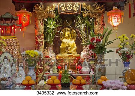 Stock Image - France. Paris 13th district. Parisian Chinatown. Altar of the Buddhist temple of the Association of the Residents in France of Indo-Chinese origin. Rue du Disque. Olympiades district. Fotosearch