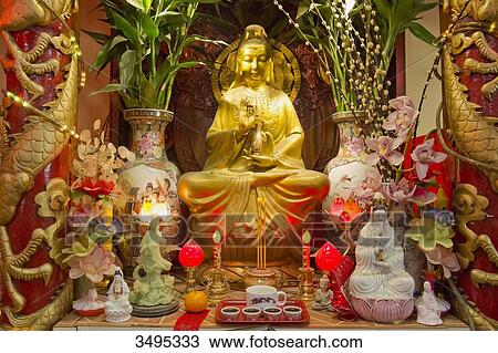 Stock Image - France. Paris 13th district. Parisian Chinatown. Altar of the Buddhist temple of the Association of the Residents in France of Indo-Chinese origin. Rue du Disque. Olympiades district. Fotosearch