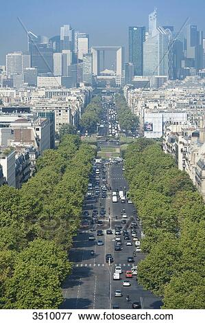 Stock Photo - France. Paris 16th district. Area of Place de l'Etoile. Avenue de la Grande Arme. In the background: buildings of La Defense. Fotosearch