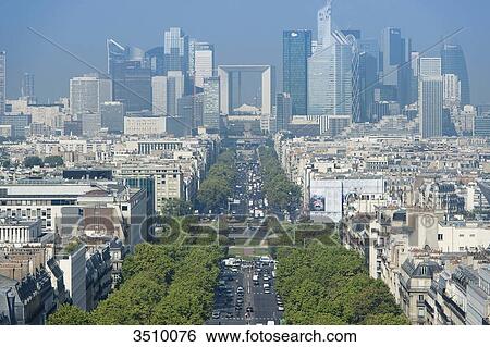 Stock Photograph - France. Paris 16th district. Area of Place de l'Etoile. Avenue de la Grande Arme. In the background: buildings of La Defense. Fotosearch