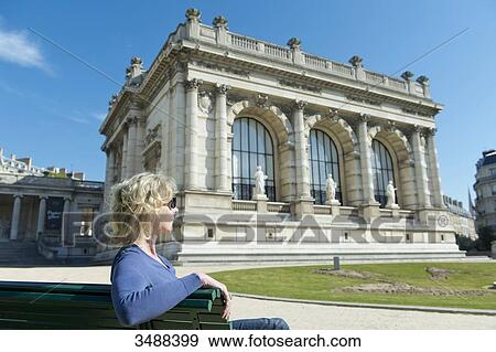 France. Paris 16th district. Woman on a bench in front of the Galliera palace, the museum of the fashion of the City of Paris. Architect: Leon Ginain (1894). View Large Photo Image Stock Photo - France. Paris 16th district. Woman on a bench in front of the Galliera palace, the museum of the fashion of the City of Paris. Architect: Leon Ginain (1894).. Fotosearch