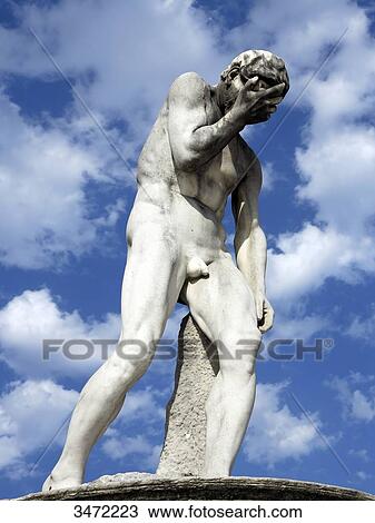 Stock Image - France, Paris. 1st arrondissement. Jardin des Tuileries. Sculpture Cain after killing his brother Abel by Henri Vidal.. Fotosearch