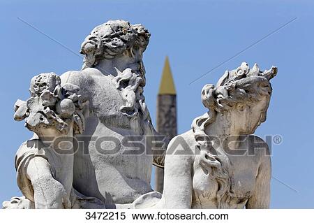 Stock Photography - France, Paris. 1st arrondissement. Jardin des Tuileries. Sculpture The Loire and the Loiret by Corneille van Cleve. The Luxor Obelisk in the background.. Fotosearch