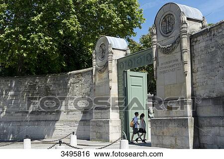 Stock Photograph - France, Paris 20th district. Entrance of the Pere Lachaise cemetery. Fotosearch