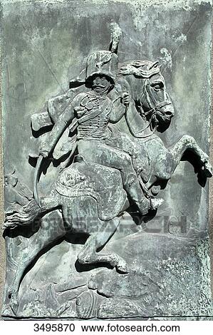 Stock Image - France, Paris 20th district. Pere Lachaise cemetery. Grave of the painter Gricault (1791-1824), by the sculptor Antoine Etex in 1840. Bronze bas-relief representing a picture of Gericault The Charging Chasseur. Fotosearch