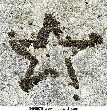 Stock Photo - France, Paris 20th district. Pere Lachaise cemetery. Star engraved on a grave. Fotosearch