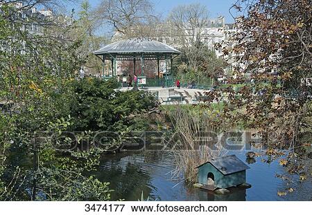 Stock Photo - France, Paris, 3rd district. The Marais. Public garden of the Temple. Fotosearch