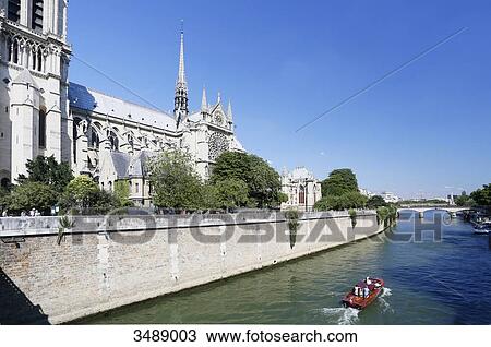 France, Paris, 4th arrondissement, Ile de la Cite, Notre-Dame Cathedral. Recreational boat sailing on the Seine. View Large Photo Image Stock Image - France, Paris, 4th arrondissement, Ile de la Cite, Notre-Dame Cathedral. Recreational boat sailing on the Seine.. Fotosearch