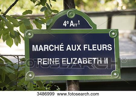 Stock Photo - France. Paris 4th district. Ile de la Cite. Place Louis Lepine. Street plate of the Flower market renamed Flower market Queen Elisabeth II on June 7th, 2014. Fotosearch
