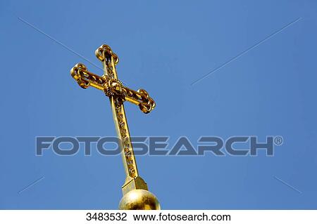 Stock Image - France, Paris. 8th district. Orthodox Alexander Nevsky Cathedral. Closeup of the cross of Christ on the front.. Fotosearch