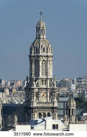 Stock Image - France. Paris 9th district. Bell tower of the Sainte Trinit church.. Fotosearch