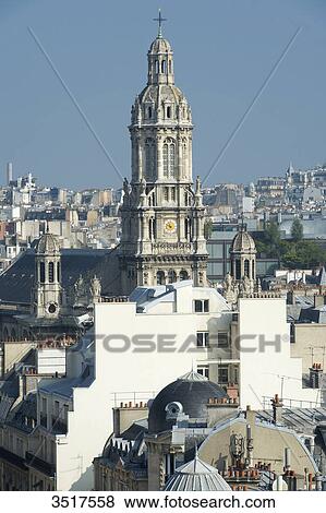 Stock Photo - France. Paris 9th district. Bell tower of the Sainte Trinit church.. Fotosearch