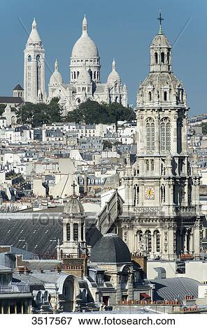 France. Paris 9th district. Bell tower of the Sainte Trinit church and the Sacre-Cur Basilica View Large Photo Image Stock Photo - France. Paris 9th district. Bell tower of the Sainte Trinit church and the Sacre-Cur Basilica. Fotosearch