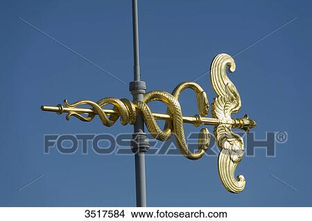 France. Paris 9th district. Caduceus weather vane of the terrace of the department store Au Printemps View Large Photo Image Picture - France. Paris 9th district. Caduceus weather vane of the terrace of the department store Au Printemps. Fotosearch