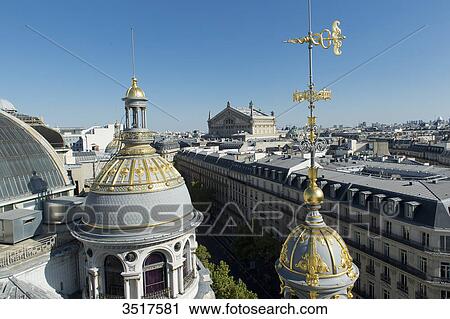 Stock Image - France. Paris 9th district. Turret of the department store Au Printemps. Far off: the Garnier Opera. Fotosearch