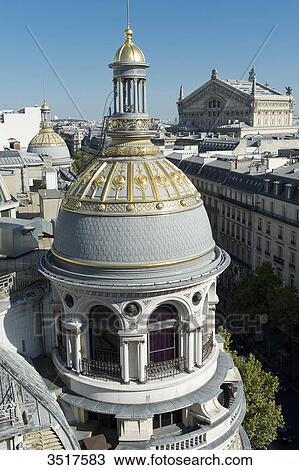 France. Paris 9th district. Turret of the department store Au Printemps. Far off: the Garnier Opera View Large Photo Image Stock Image - France. Paris 9th district. Turret of the department store Au Printemps. Far off: the Garnier Opera. Fotosearch