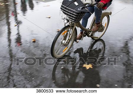 France, Paris, a cyclist in the rain. View Large Photo Image Stock Image - France, Paris, a cyclist in the rain.. Fotosearch