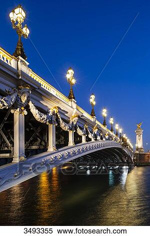 Stock Photography - France, Paris, Alexandre III bridge at night. Fotosearch