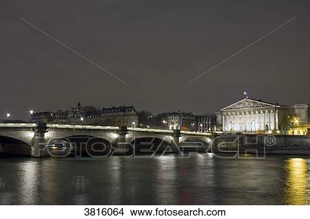 Picture - France, Paris, Concorde Bridge and Palais Bourbon (National Assembly), at night.. Fotosearch